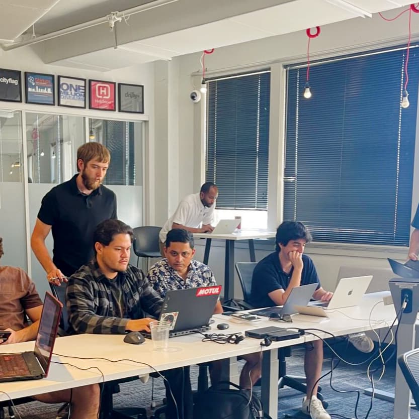 a group of people sitting around a table