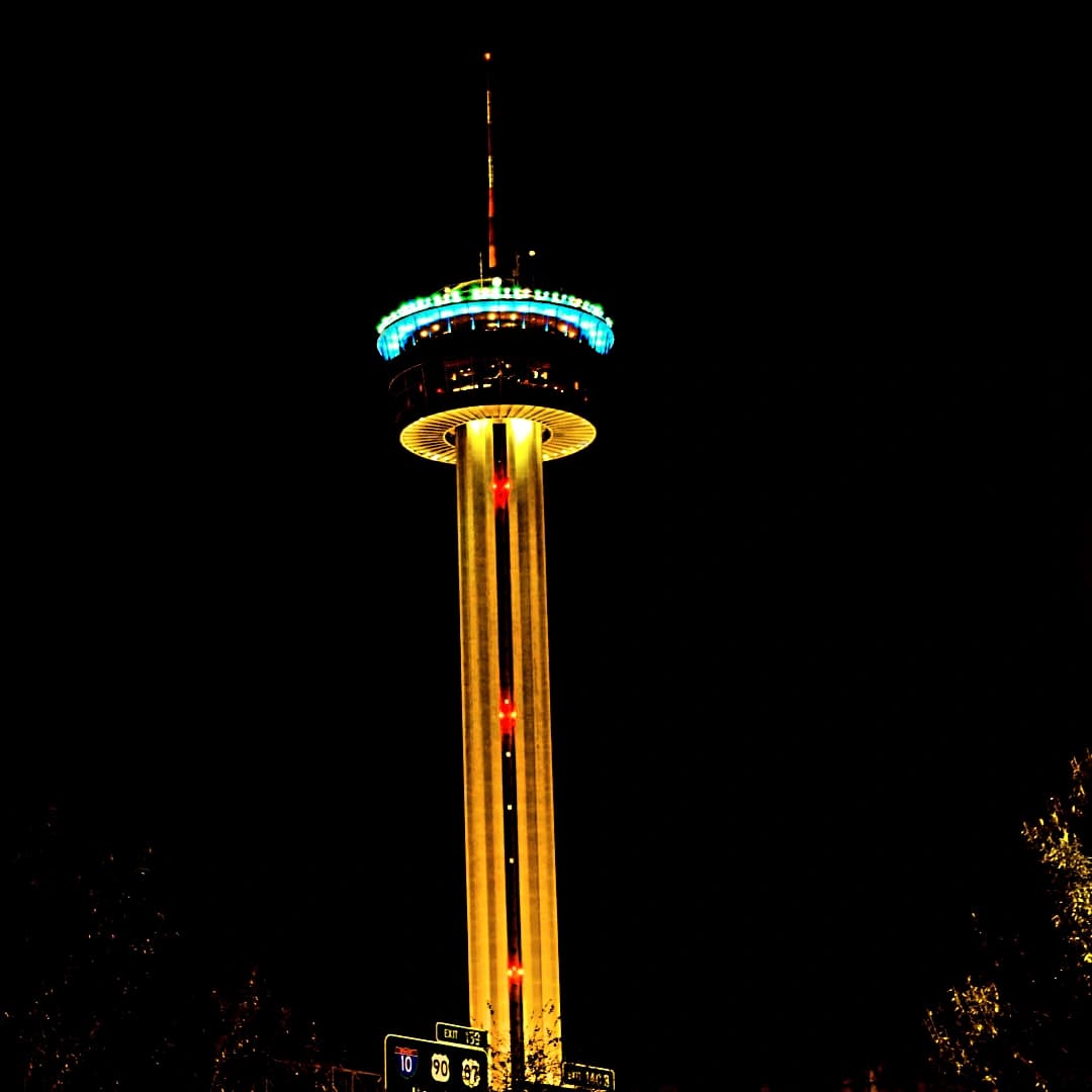 a tall tower lit up at night