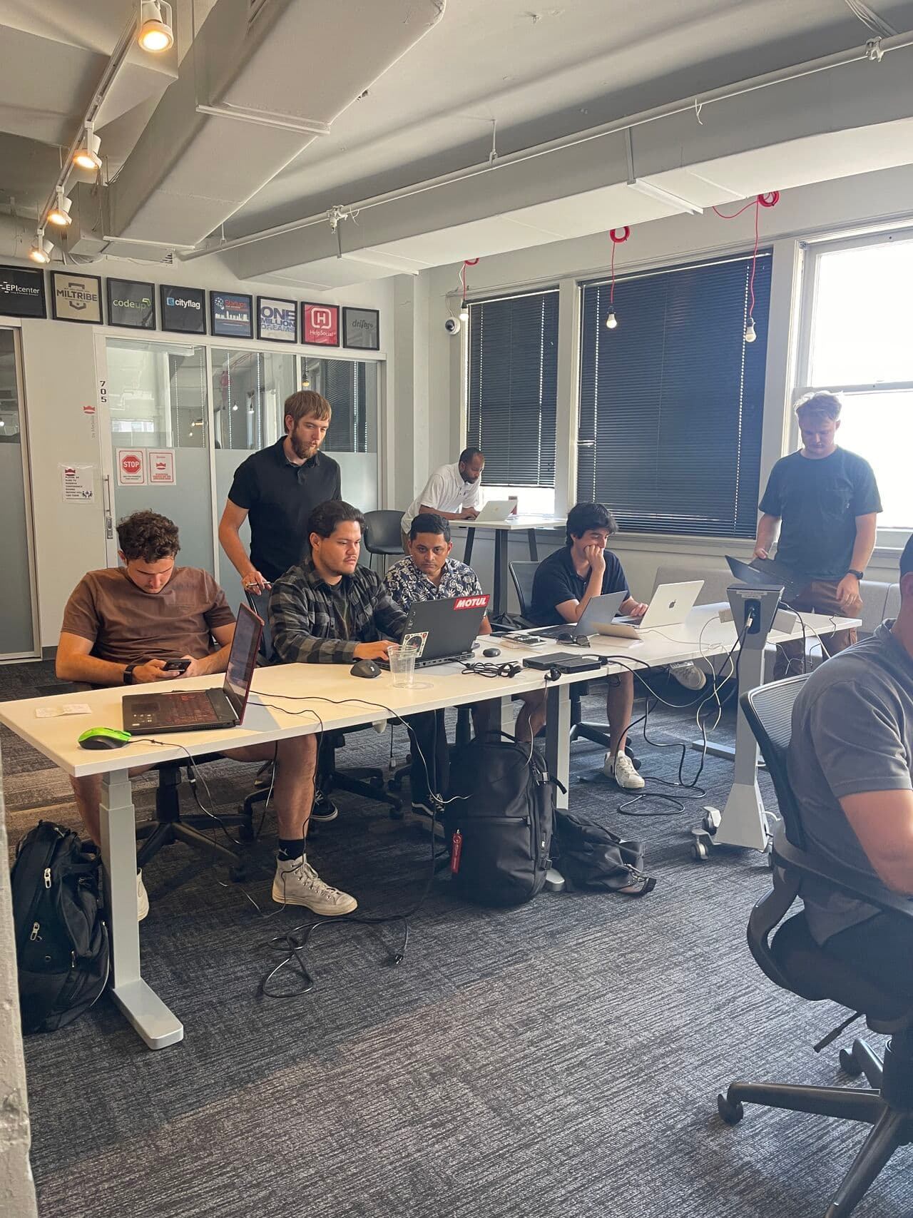 a group of people sitting around a table
