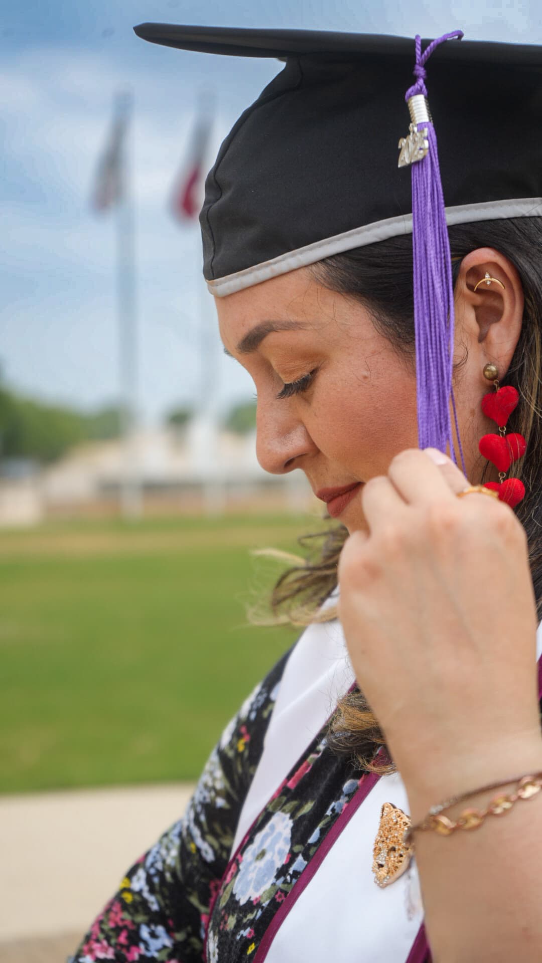 a woman in a graduation cap and gown