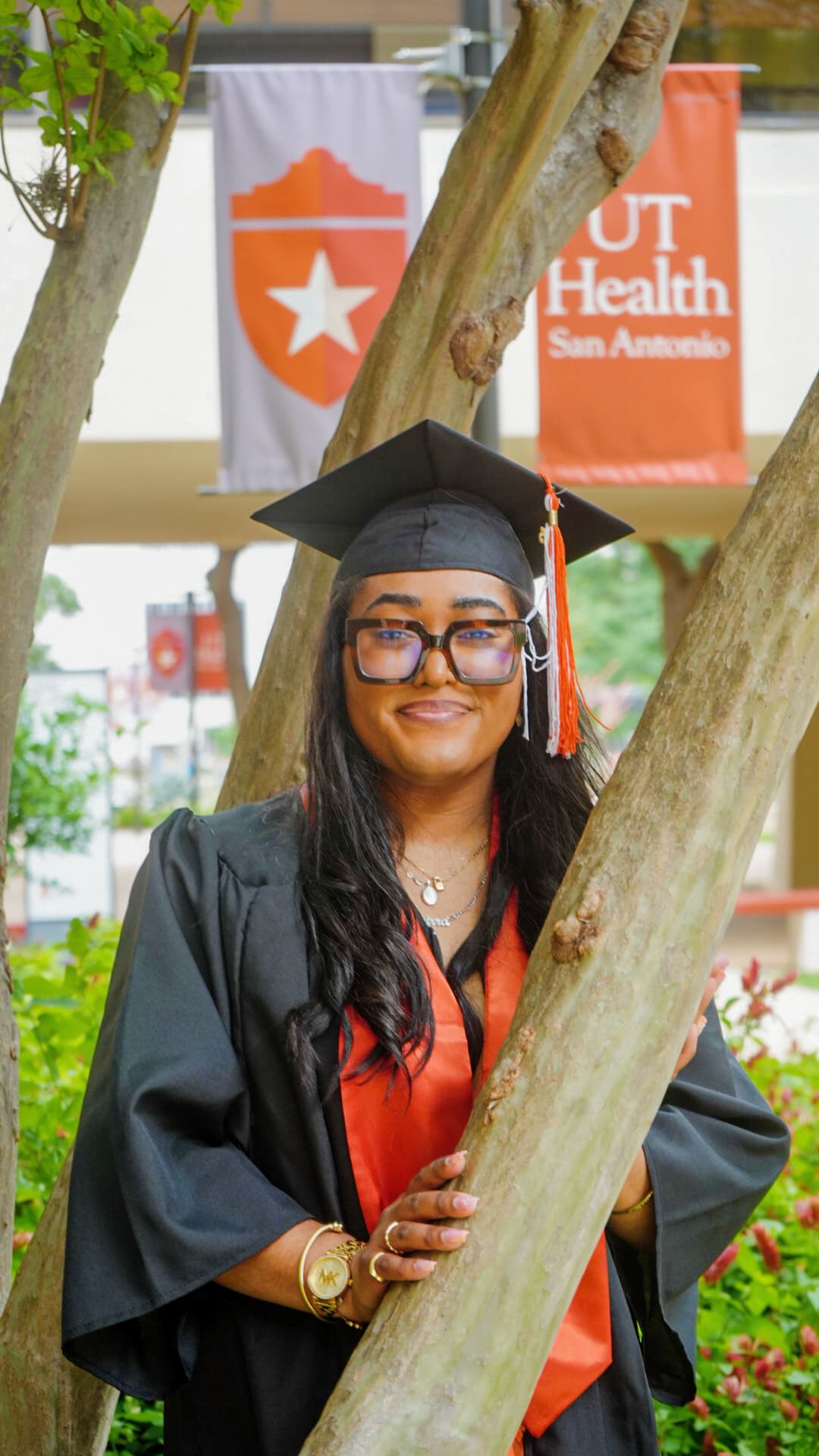 a woman in a graduation gown and cap