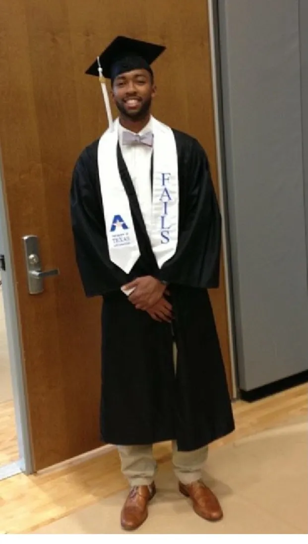 a man in a graduation gown and cap
