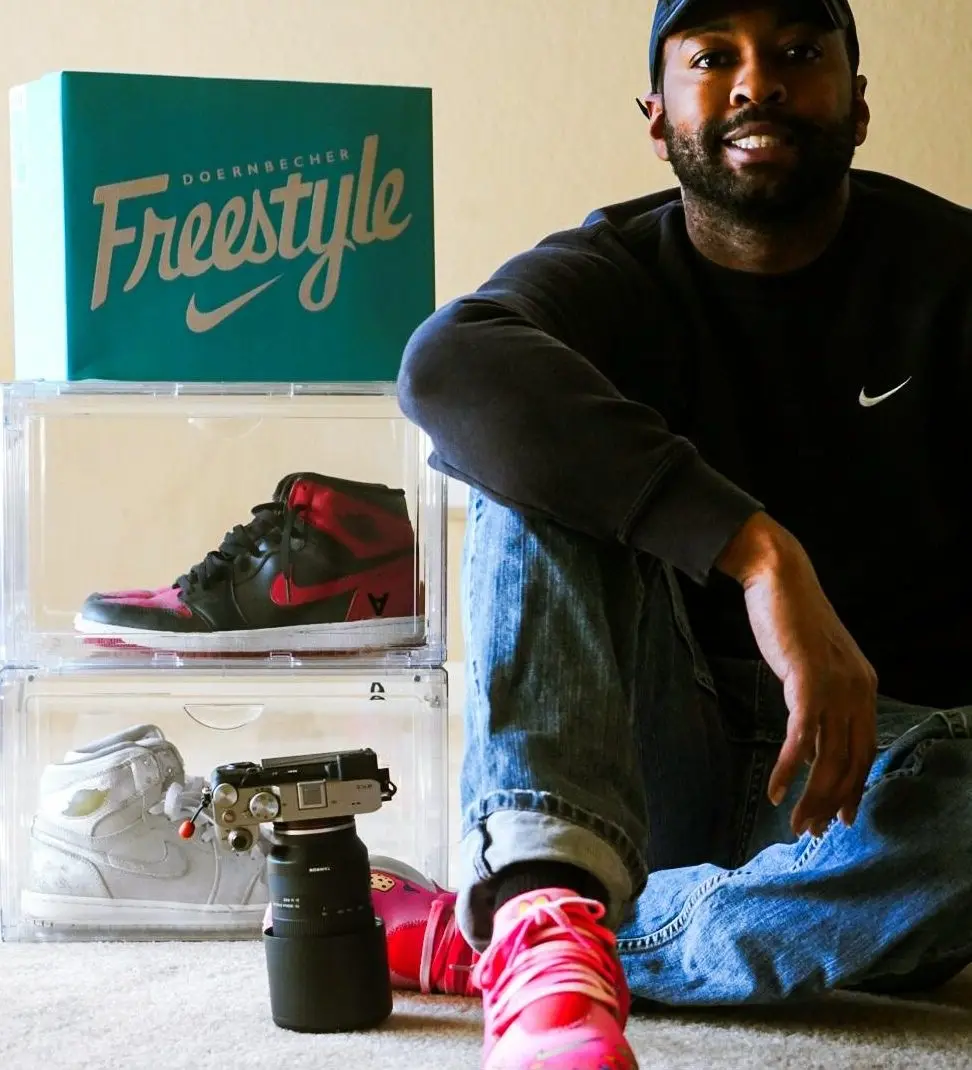 a man sitting on the floor with his feet up