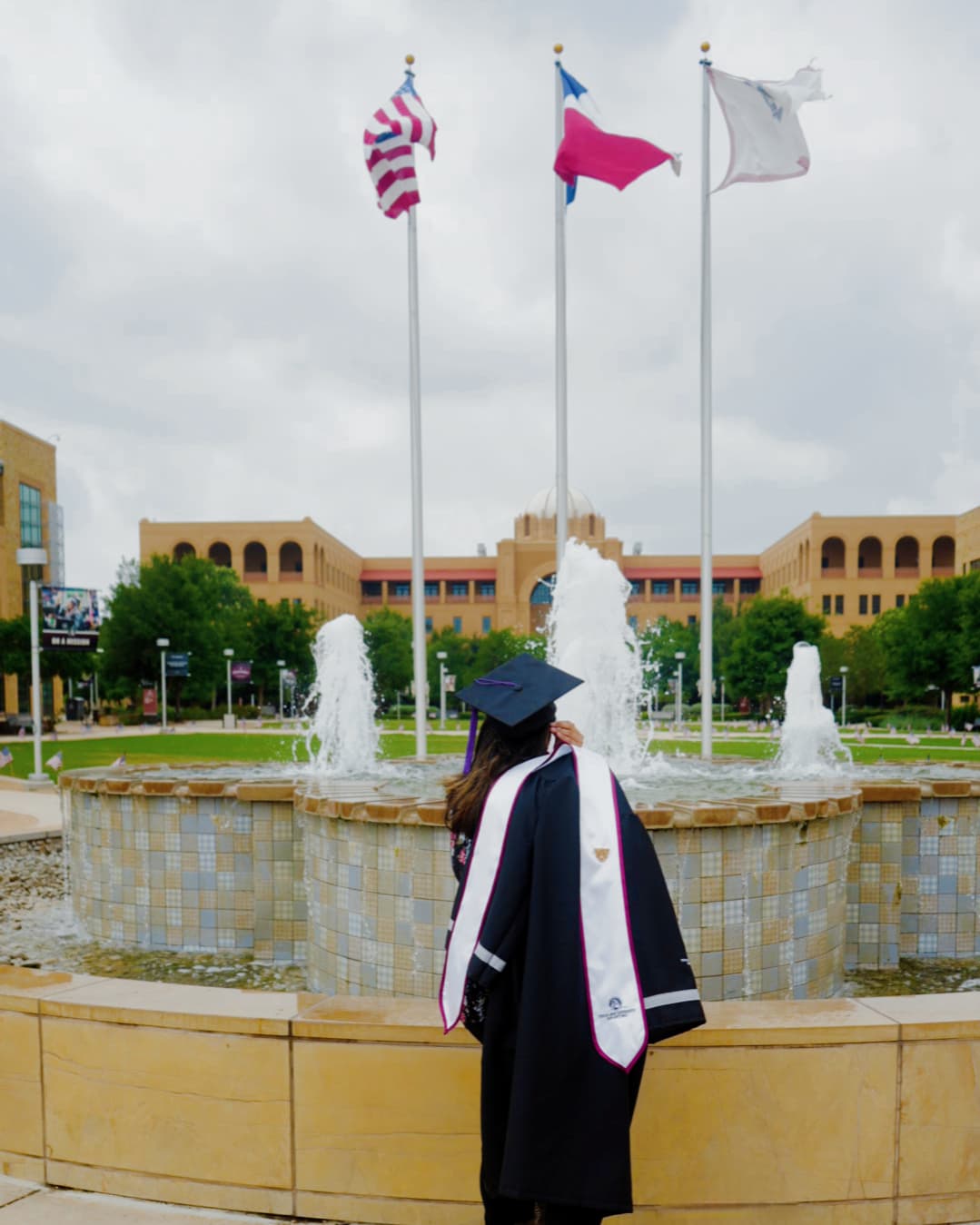 a woman in a graduation gown