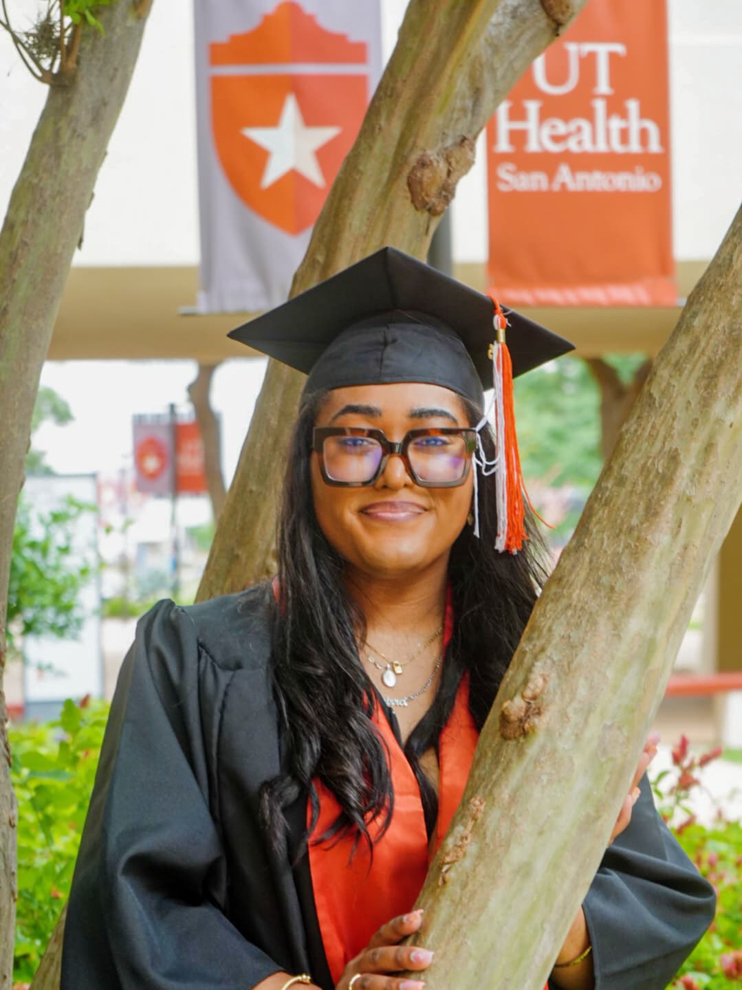 a woman in a graduation gown and cap